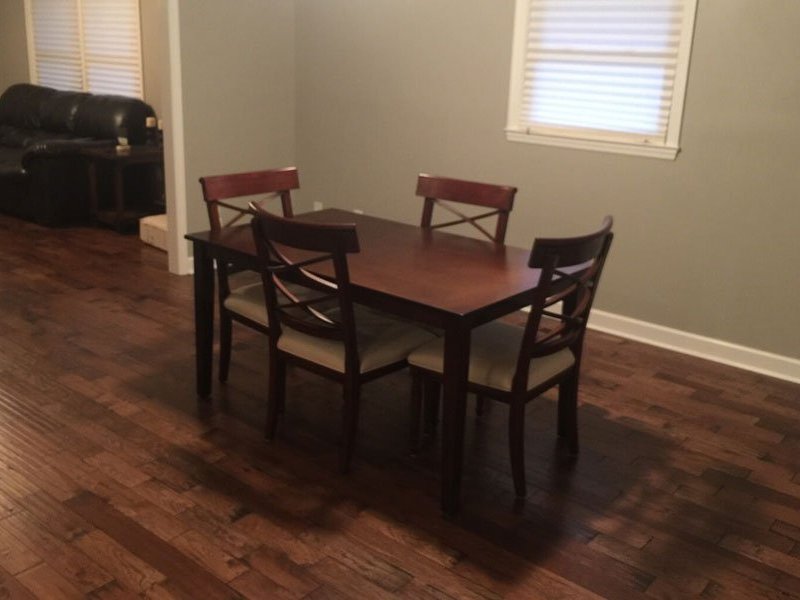 brown table and chairs on brown hardwood